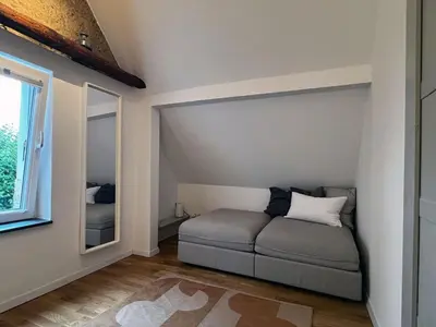 Ein Sitzbereich in der Unterkunft Charmantes Häuschen am Waldrand