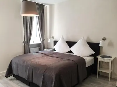 Ein Bett oder Betten in einem Zimmer der Unterkunft Bärengasse Apartments
