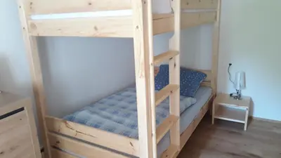 Ein Bett oder Betten in einem Zimmer der Unterkunft Ferienwohnungen Lamm Spiegelberg-Jux