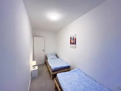 Ein Bett oder Betten in einem Zimmer der Unterkunft Modern and Cozy Apartment in Heilbronn