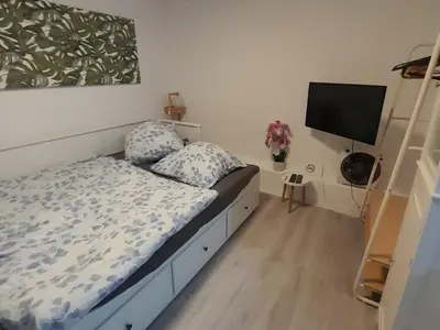 Ein Bett oder Betten in einem Zimmer der Unterkunft Apartment am Palmenhaus