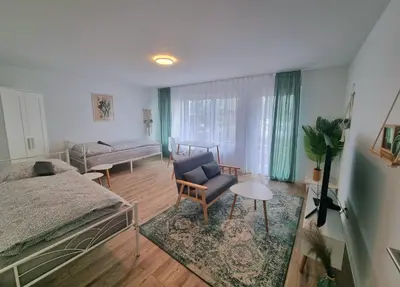 Ein Bett oder Betten in einem Zimmer der Unterkunft Residence Apartments