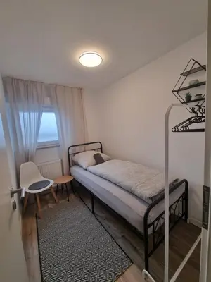 Ein Bett oder Betten in einem Zimmer der Unterkunft Residence Apartments