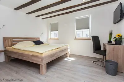 Ein Bett oder Betten in einem Zimmer der Unterkunft Hotel Duwakschopp