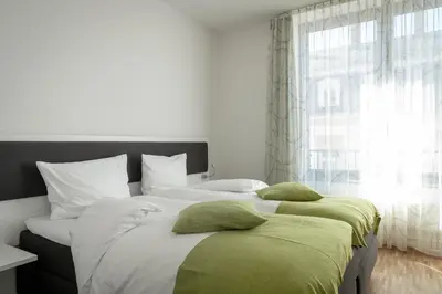 Ein Bett oder Betten in einem Zimmer der Unterkunft Gästehaus am Schloss