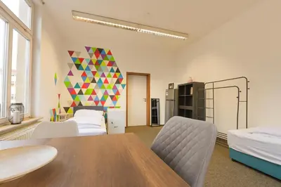 Ein Bett oder Betten in einem Zimmer der Unterkunft G-Living Wilhelmstraße