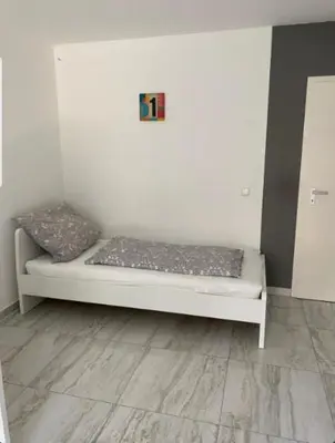 Ein Bett oder Betten in einem Zimmer der Unterkunft Gemütliche Wohnung im Herzen von Heidelberg