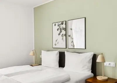 Ein Bett oder Betten in einem Zimmer der Unterkunft Limehome Karlsruhe Kaiserstraße