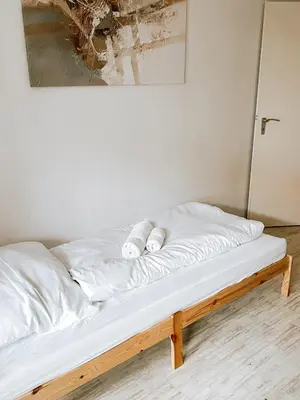 Ein Bett oder Betten in einem Zimmer der Unterkunft DoreyHome HN1 - Stilvolles Apartment zentral in Heilbronn - 7 Personen - WLAN