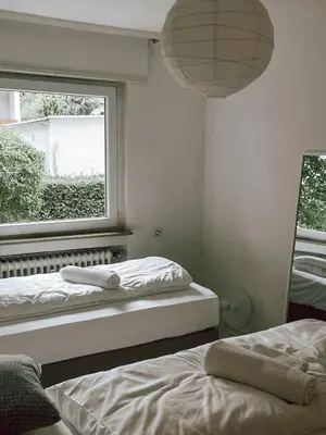 Ein Bett oder Betten in einem Zimmer der Unterkunft DoreyHome HN1 - Stilvolles Apartment zentral in Heilbronn - 7 Personen - WLAN