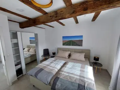 Ein Bett oder Betten in einem Zimmer der Unterkunft Südpfalznest