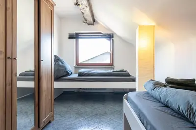 Ein Bett oder Betten in einem Zimmer der Unterkunft Wohnung für 4 Personen mit 2 Schlafzimmer, Wohnzimmer, Küche