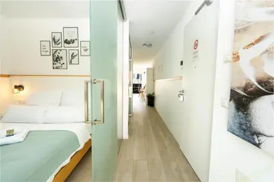 Ein Bett oder Betten in einem Zimmer der Unterkunft Sali Homes Apartmenthaus Schlossgasse