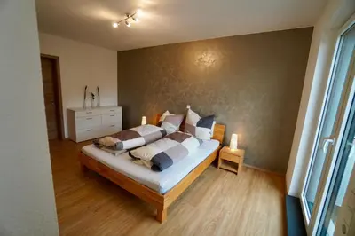 Ein Bett oder Betten in einem Zimmer der Unterkunft Ferienhaus Rebenhof