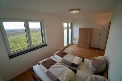 Ein Bett oder Betten in einem Zimmer der Unterkunft Ferienhaus Rebenhof