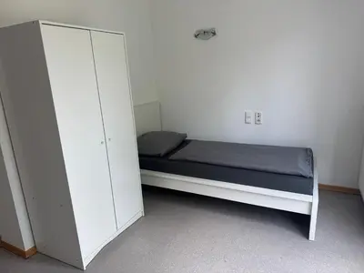 Ein Bett oder Betten in einem Zimmer der Unterkunft R&R Apartments - Boardinghouse