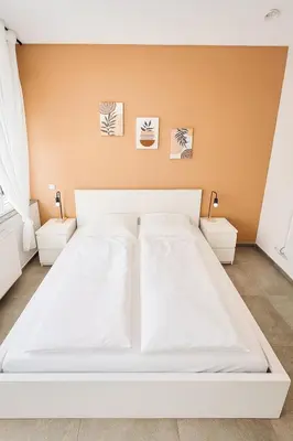 Ein Bett oder Betten in einem Zimmer der Unterkunft Ok Apartments