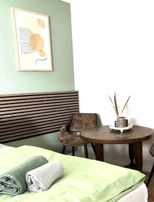 Ein Bett oder Betten in einem Zimmer der Unterkunft CityapartmentWorms, urbaner Rückzugsort