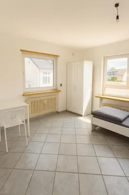 Ein Bett oder Betten in einem Zimmer der Unterkunft Monteur- und Ferienwohnung Rheinhausen - Lönsweg