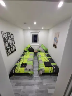 Ein Bett oder Betten in einem Zimmer der Unterkunft GR ooms-Rent