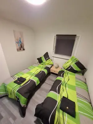Ein Bett oder Betten in einem Zimmer der Unterkunft GR ooms-Rent