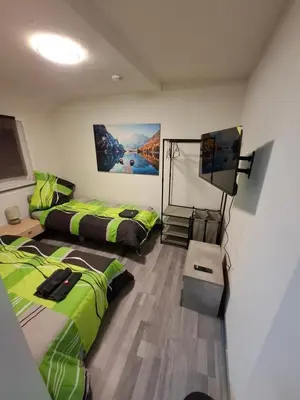 Ein Bett oder Betten in einem Zimmer der Unterkunft GR ooms-Rent