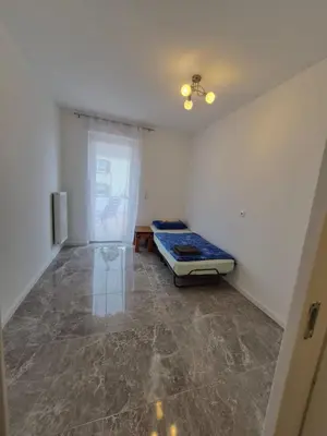 Ein Bett oder Betten in einem Zimmer der Unterkunft Tami