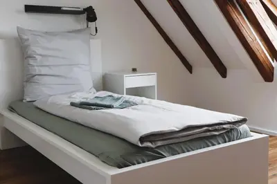 Ein Bett oder Betten in einem Zimmer der Unterkunft ZeitRaum Apartments Heilbronn