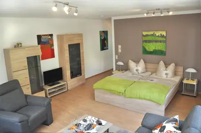 Ein Bett oder Betten in einem Zimmer der Unterkunft Ferienwohnung in den Weinreben