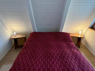 Ein Bett oder Betten in einem Zimmer der Unterkunft NurdachZeit – Ferienhaus in Schellbronn