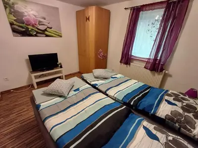 Ein Bett oder Betten in einem Zimmer der Unterkunft Ferienwohnung zum Finkenbachtal