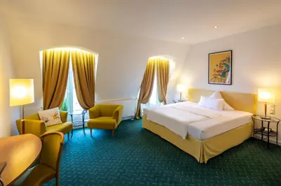 Ein Bett oder Betten in einem Zimmer der Unterkunft Hotel Artrium am Park