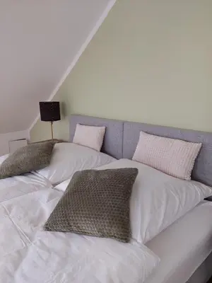Ein Bett oder Betten in einem Zimmer der Unterkunft Apartment Senfnest
