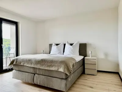 Ein Bett oder Betten in einem Zimmer der Unterkunft FREIRAUM Apartments Neuleiningen