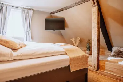 Ein Bett oder Betten in einem Zimmer der Unterkunft Schmuckers Ferienstube
