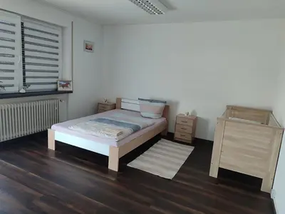 Ein Bett oder Betten in einem Zimmer der Unterkunft J&V Zimmer II Walldürn