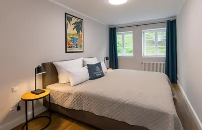 Ein Bett oder Betten in einem Zimmer der Unterkunft Wohnpark Hotel Heppenheim