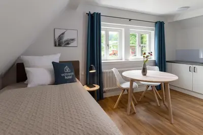 Ein Bett oder Betten in einem Zimmer der Unterkunft Wohnpark Hotel Heppenheim