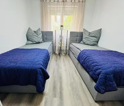 Ein Bett oder Betten in einem Zimmer der Unterkunft SRooms - Neckarwestheim