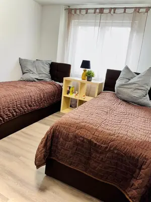Ein Bett oder Betten in einem Zimmer der Unterkunft SRooms - Neckarwestheim