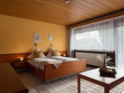 Ein Bett oder Betten in einem Zimmer der Unterkunft Hotel Garni Sebastian
