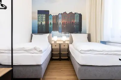 Ein Bett oder Betten in einem Zimmer der Unterkunft Renatus Apartments