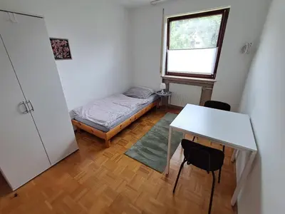 Ein Bett oder Betten in einem Zimmer der Unterkunft Boardinghouse Wildbachtal