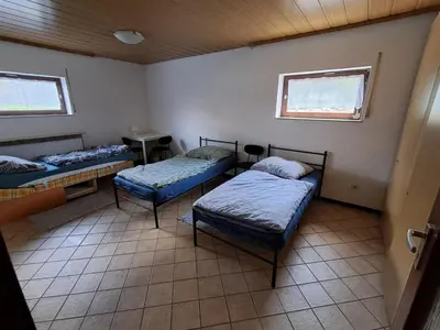 Ein Bett oder Betten in einem Zimmer der Unterkunft Boardinghouse Wildbachtal