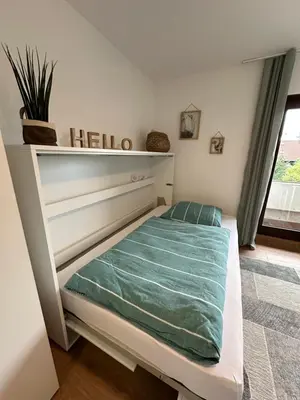Ein Bett oder Betten in einem Zimmer der Unterkunft Wohlfühlwohnung in Eppelheim - zentral und entspannt