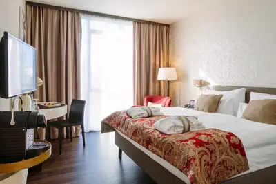 Ein Bett oder Betten in einem Zimmer der Unterkunft Chester Hotel Heidelberg