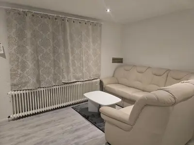 Ein Sitzbereich in der Unterkunft 1-Zimmer Woh Souterrainwohnung