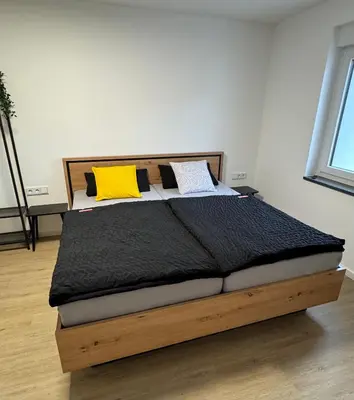 Ein Bett oder Betten in einem Zimmer der Unterkunft Ferienwohnung Lemon - Suite