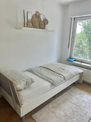 Ein Bett oder Betten in einem Zimmer der Unterkunft REHBLICK Ferienwohnung
