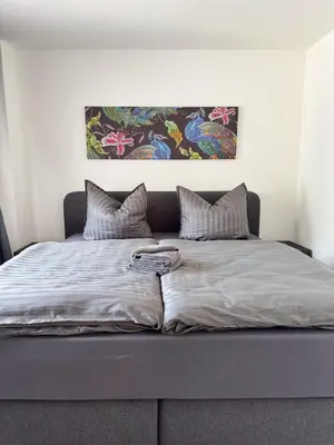 Ein Bett oder Betten in einem Zimmer der Unterkunft 2 Zimmer Apartment mit Sauna